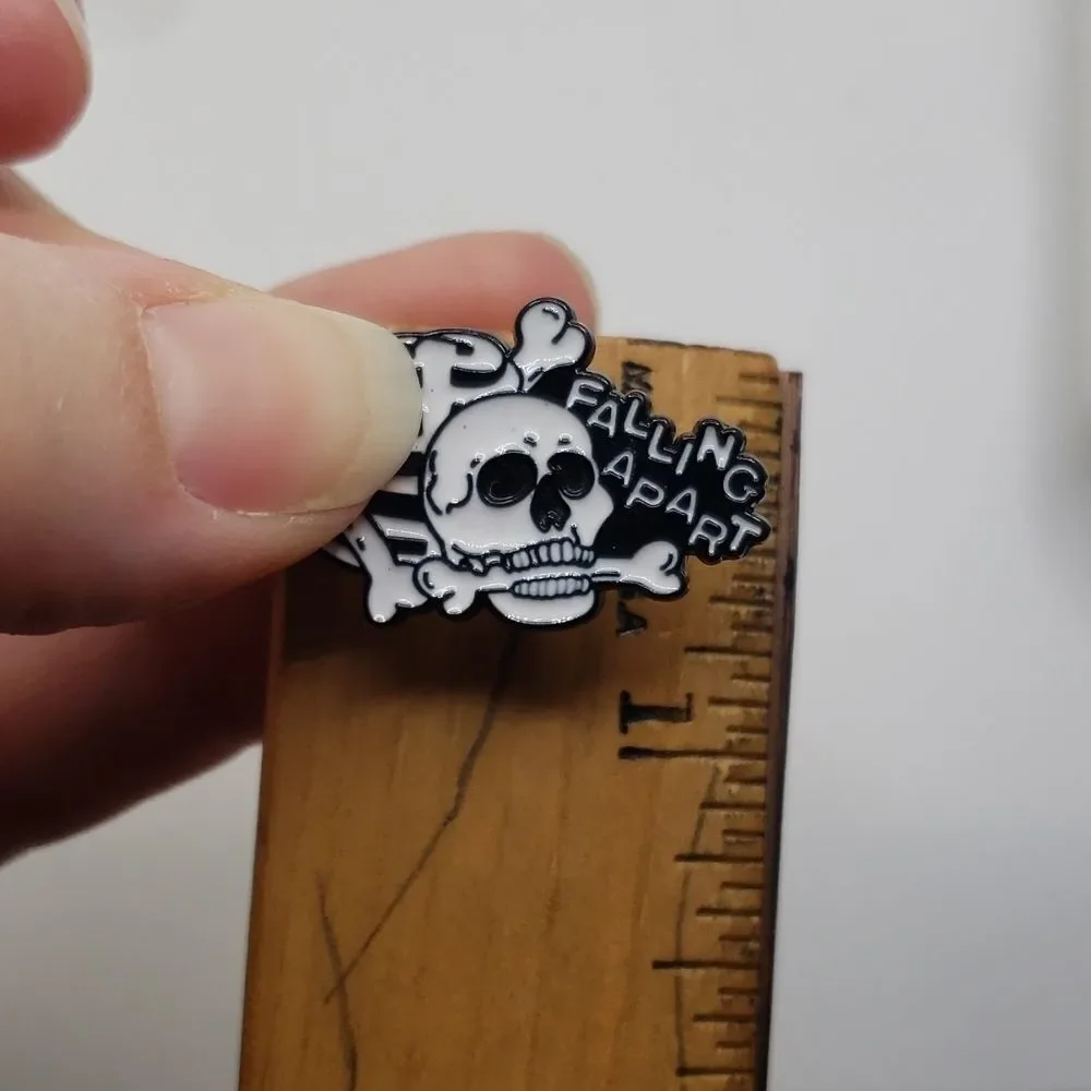 Skull and skeleton bones falling apart enamel fashion pin
